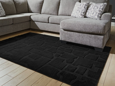 Gibbswell Washable 5' x 7' Area Rug - Sims Furniture